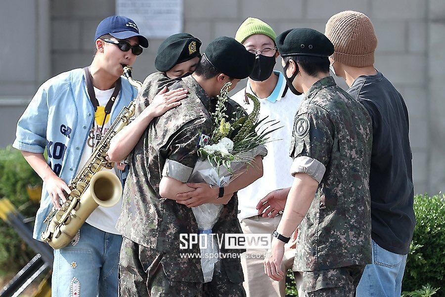 BTS members greeting Jin