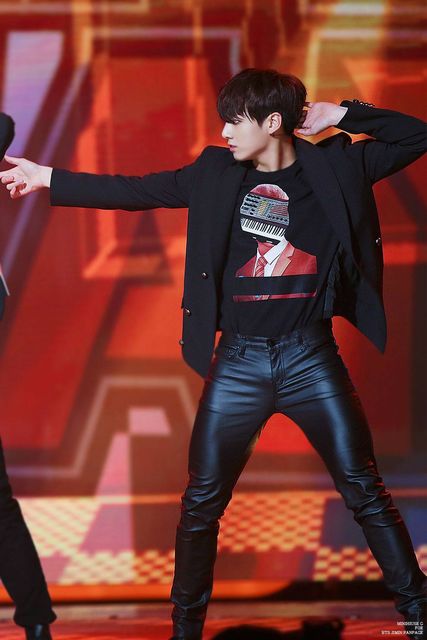 Jungkook strikes a pose in his leather pants. 