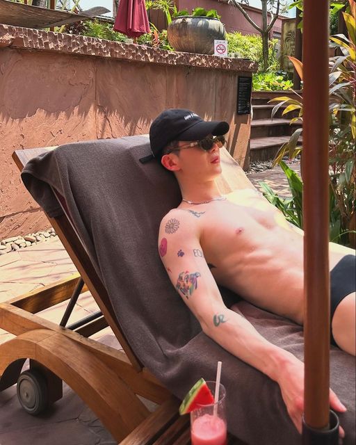 Jo Kwon lounging by pool