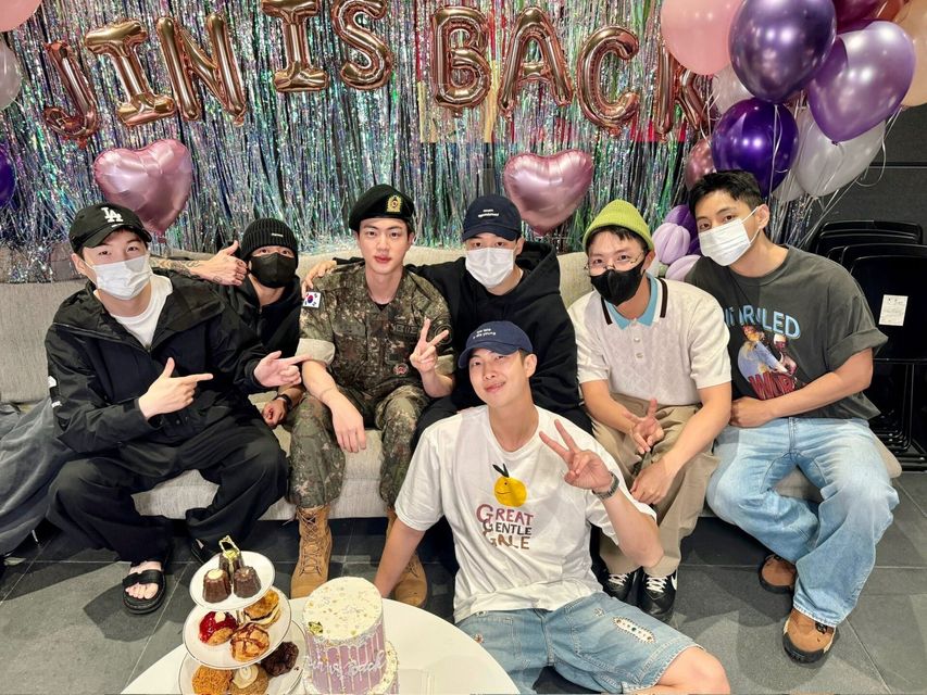 All seven BTS members at HYBE celebrating Jin's discharge