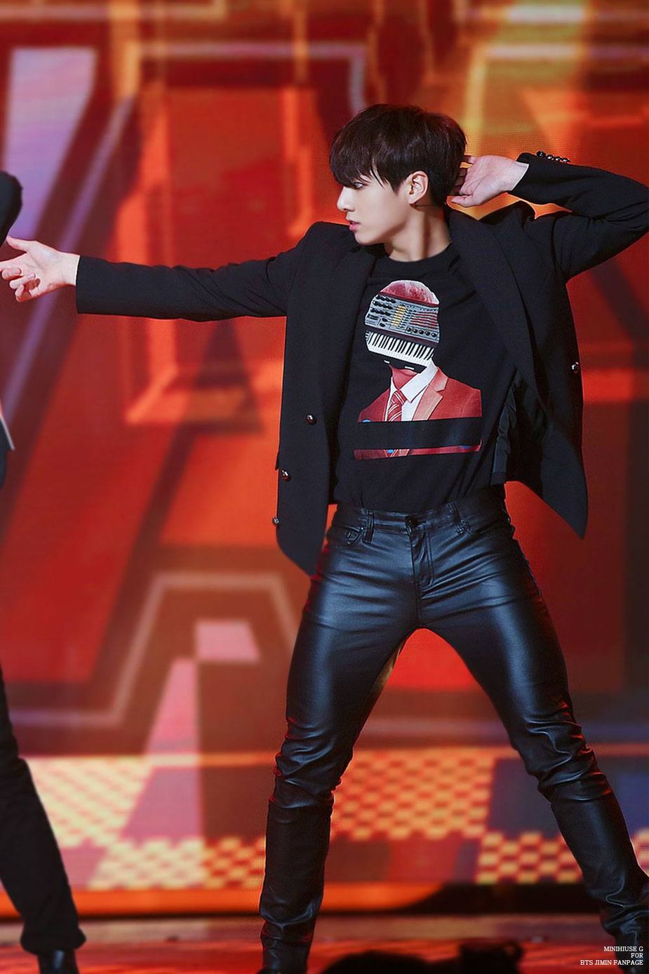Jungkook strikes a pose in his leather pants. 