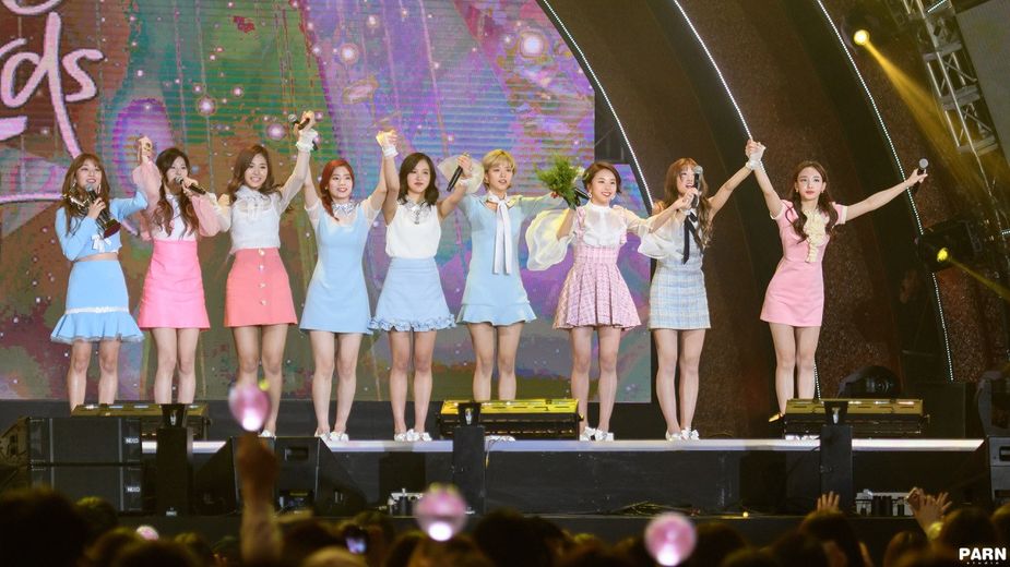 TWICE takes a bow to thank fans for their win.