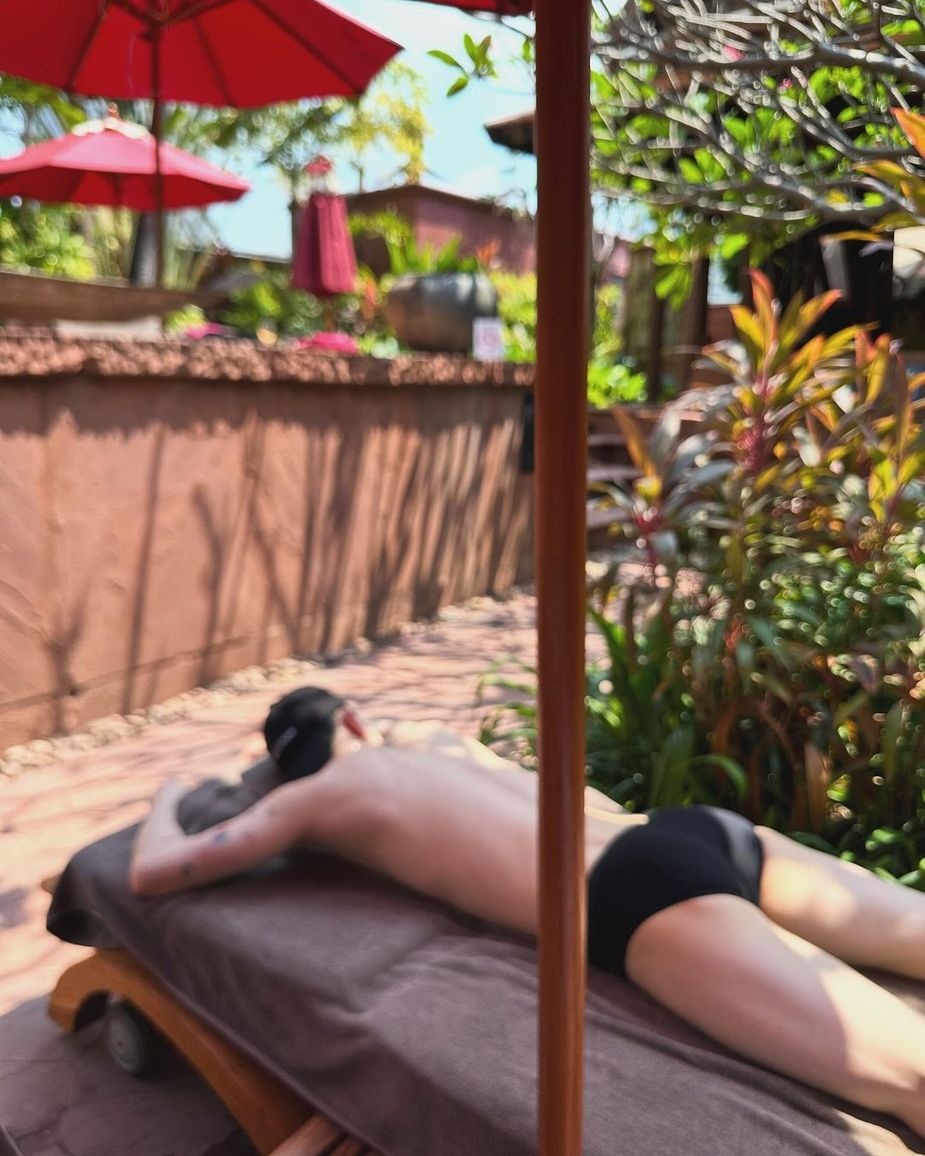 Jo Kwon resting by pool